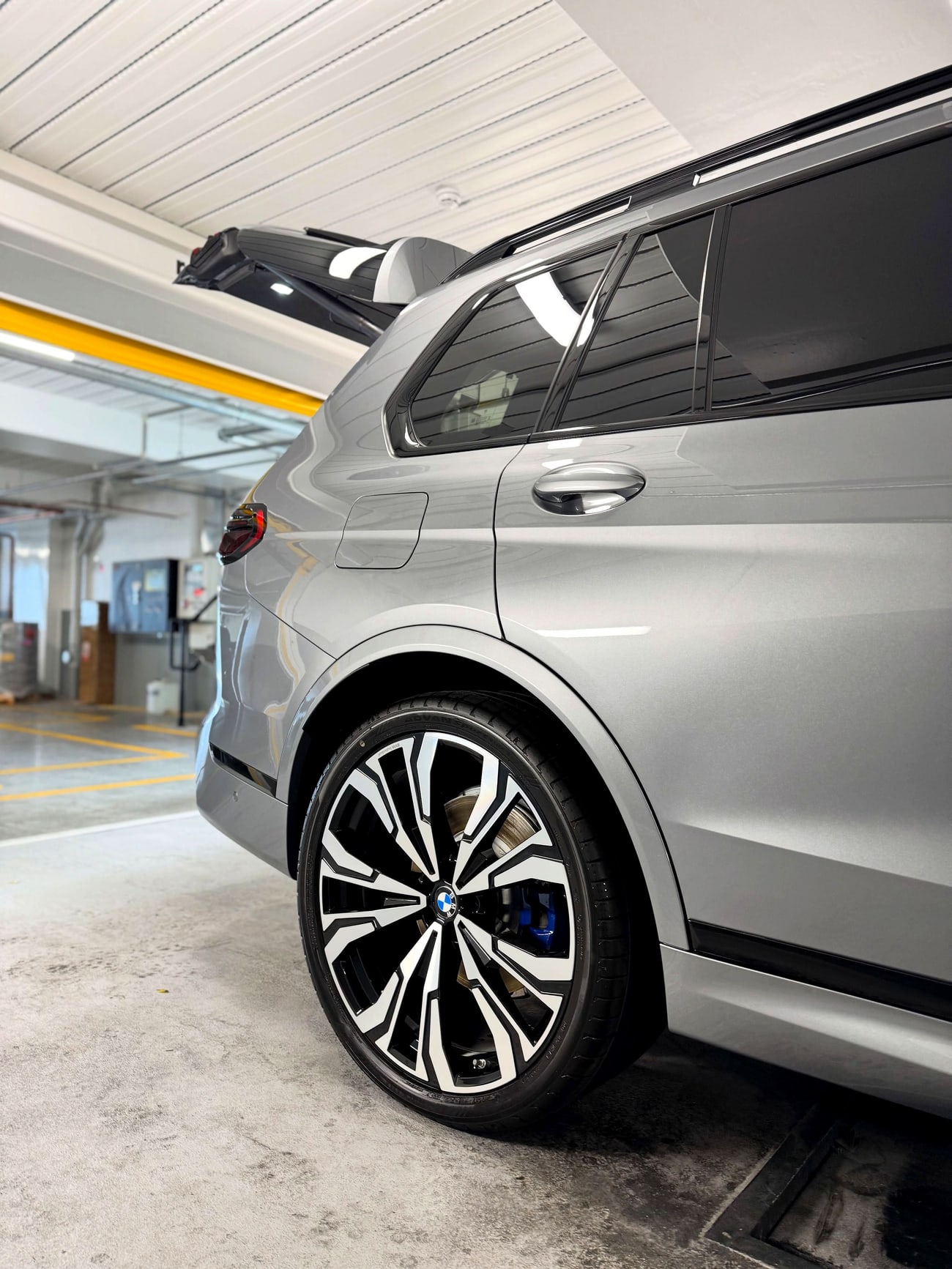 A silver car detailed inside and out, paintwork gleaming