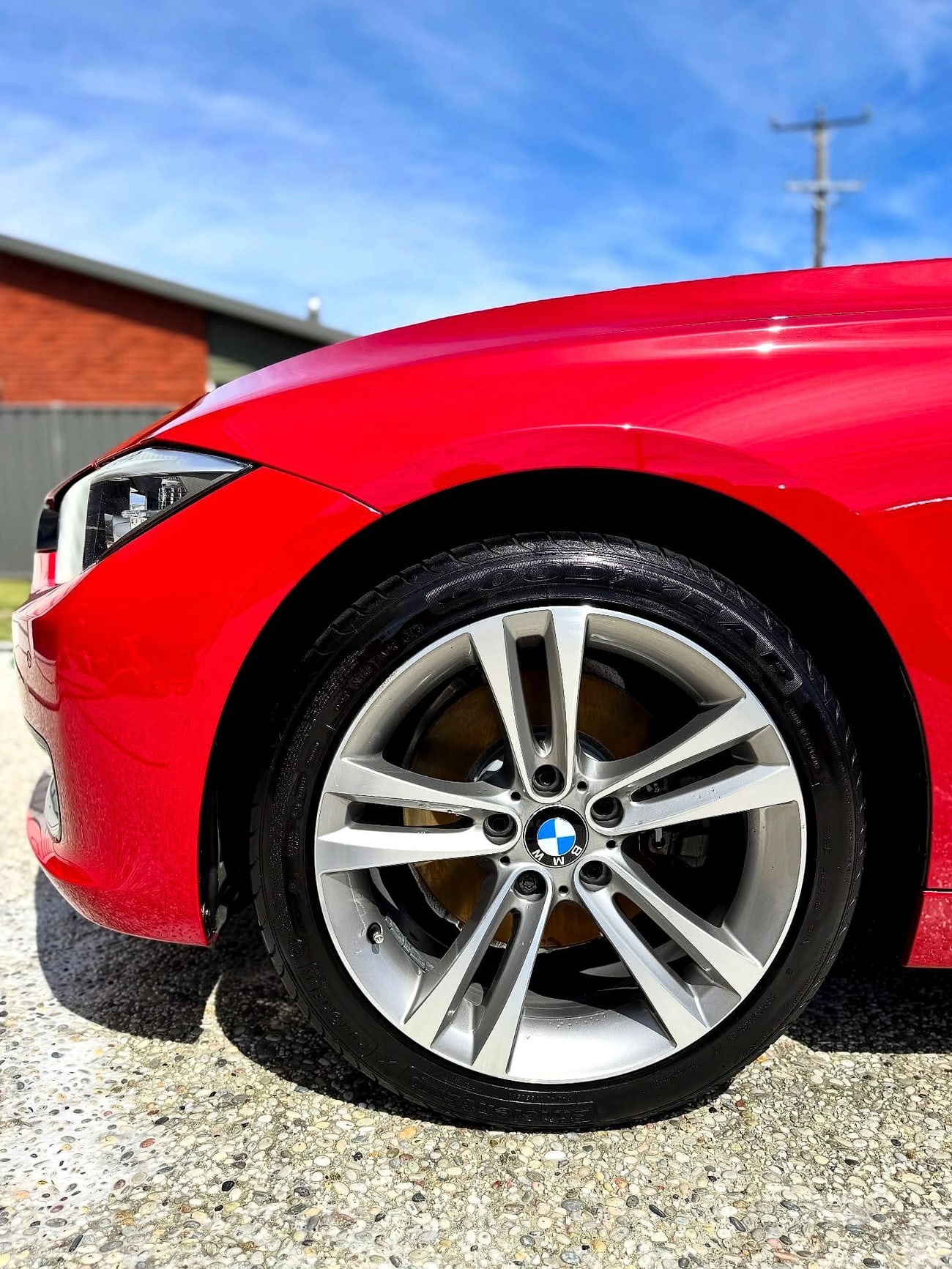 A red coupe with a deep gloss finish